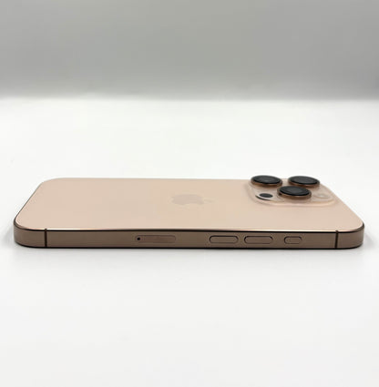 A Desert Titanium Apple iPhone 16 Pro shown from the back, featuring a triple-camera system and the Apple logo, photographed on a clean white studio background.