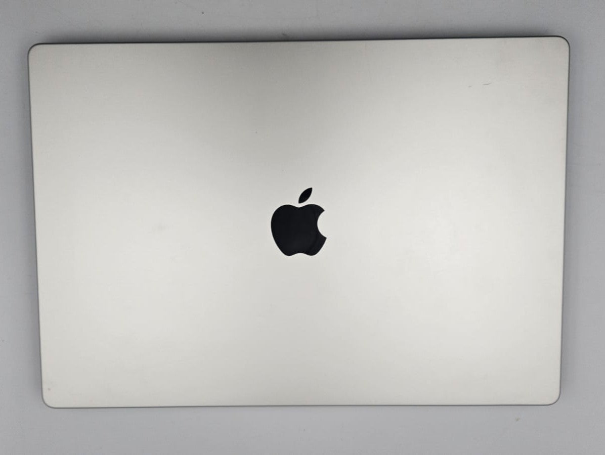 A closed silver Apple Mac Book Pro  laptop, likely a MacBook, shown from the top lid against a neutral gray background.
