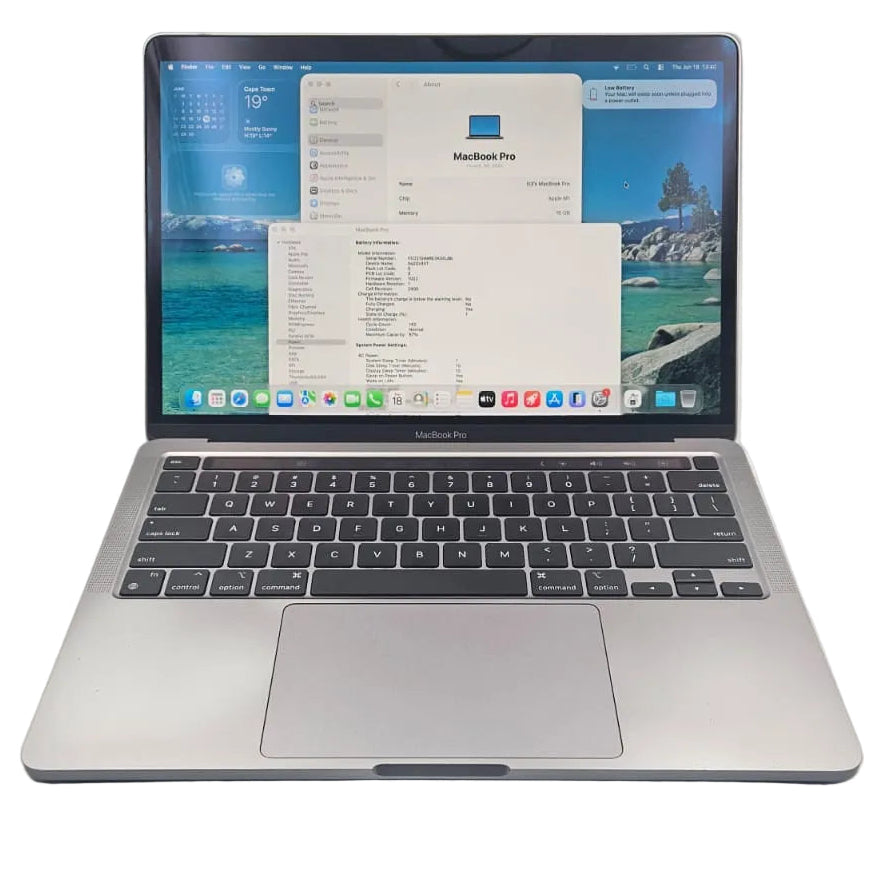 A silver Apple MacBook Pro laptop is open on a white surface, displaying its screen with multiple windows and showing the Apple logo on the keyboard deck.