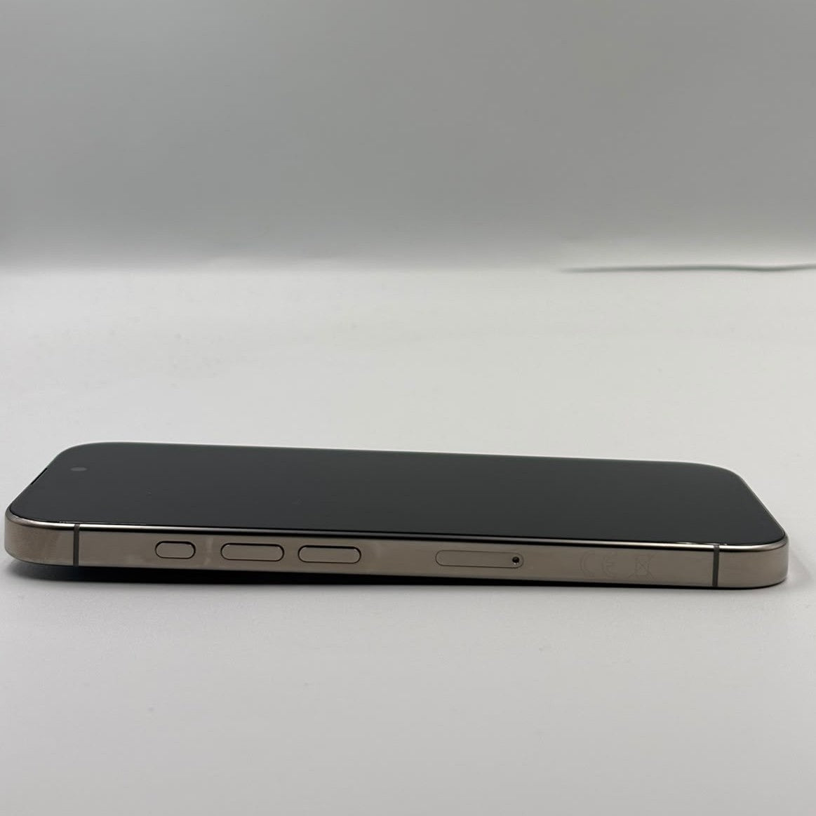 IPhone 16 Pro, sire view, showing volume buttons on white background