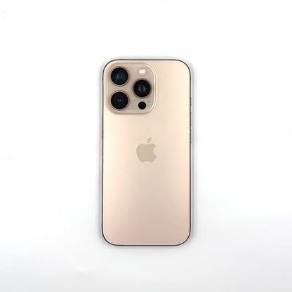 A Desert Titanium Apple iPhone 16 Pro with a clear protective bumper case, shown from the back on a clean white background.